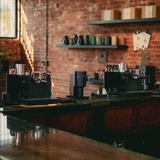 Fellow Espresso Series 1 machines lined up at the Coffeehaus Roastery in Detroit